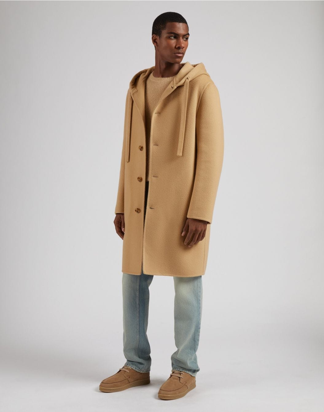 Single-breasted beige wool coat with a hood and drawstring